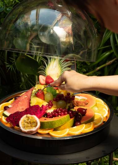 fresh fruit platter under glass dome