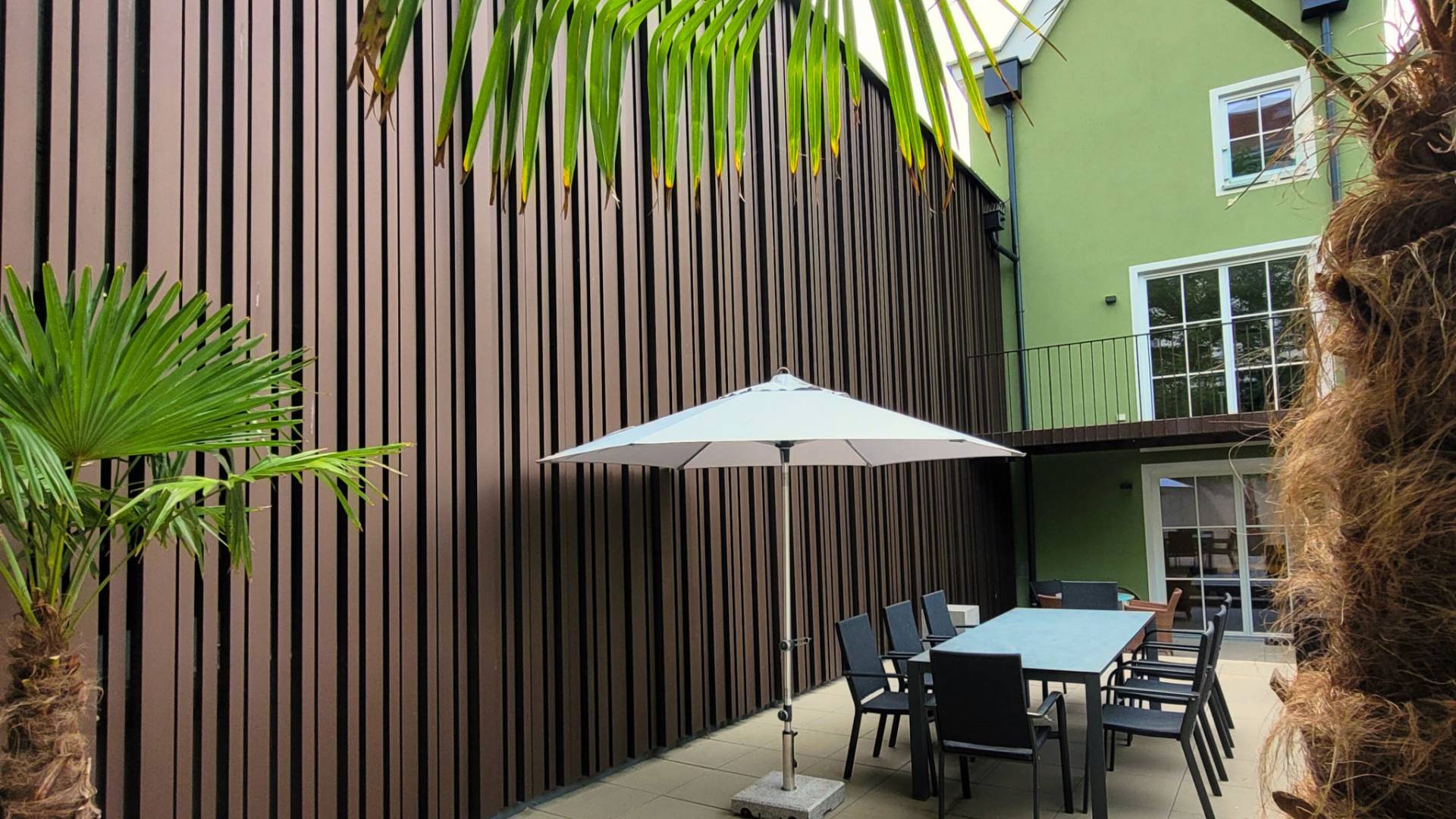 Terrace with metal faced wall