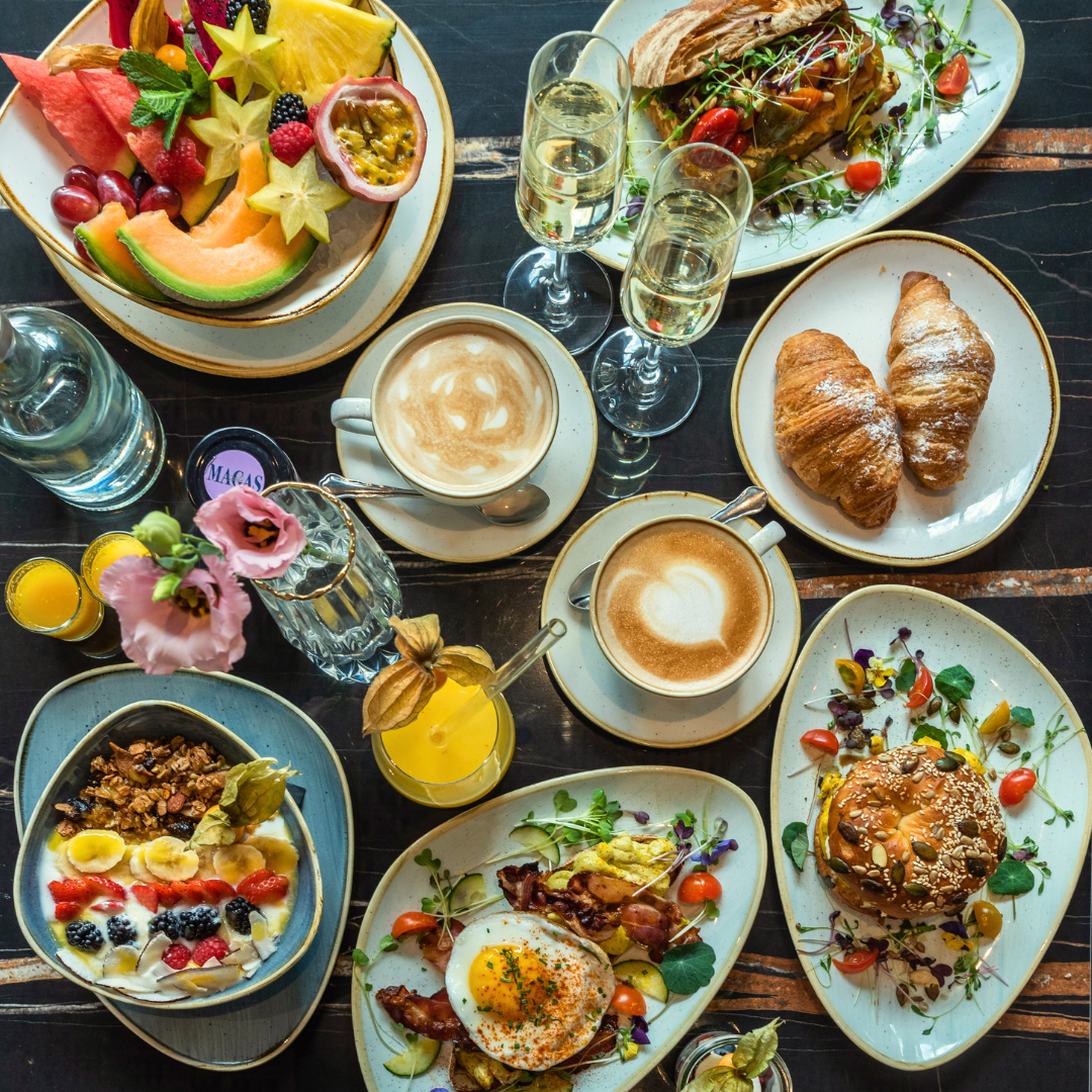 Richly set breakfast table in Magas Deli