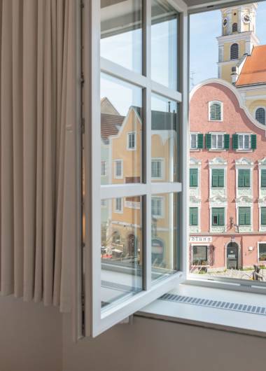 room with a view of the historic houses of Schärding