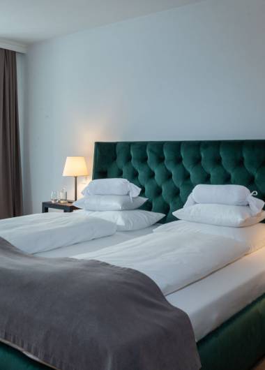 Bett im Doppelzimmer des Boutique-Hotel Forstinger 