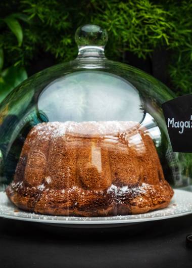 Magas marble cake under a glass dome