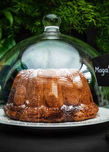 Magas marble cake under a glass dome