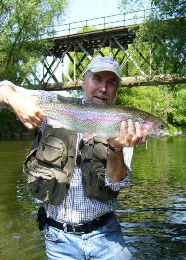 fisherman showing off his trout