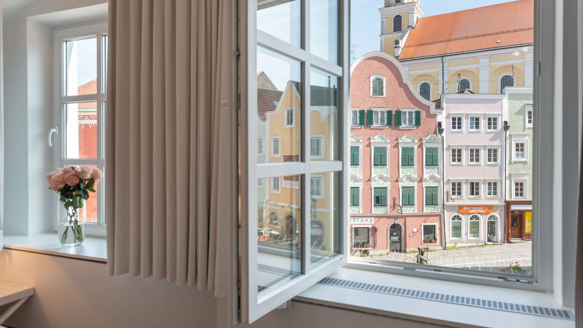 room with a view of the historic houses of Schärding