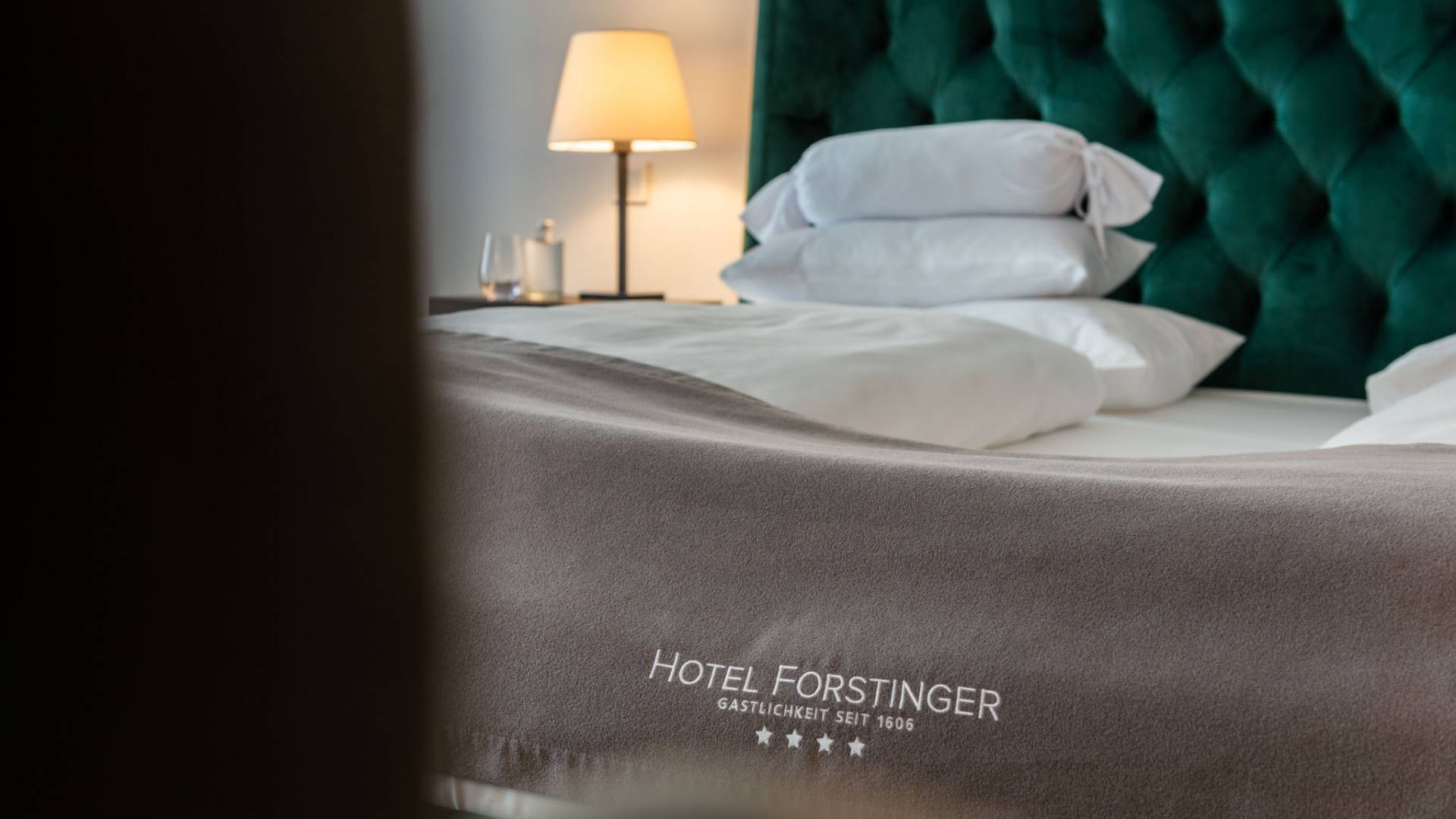 freshly made hotel bed at the hotel forstinger 